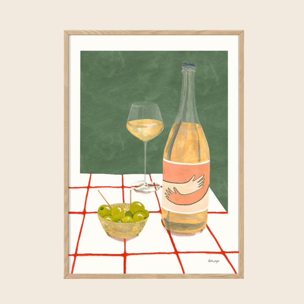 Framed artwork of a bottle of wine, glass, and bowl on a checkered tablecloth with a green chalkboard background.