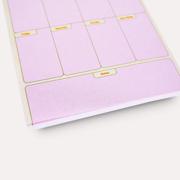 Purple planner stickers with labels on a white surface