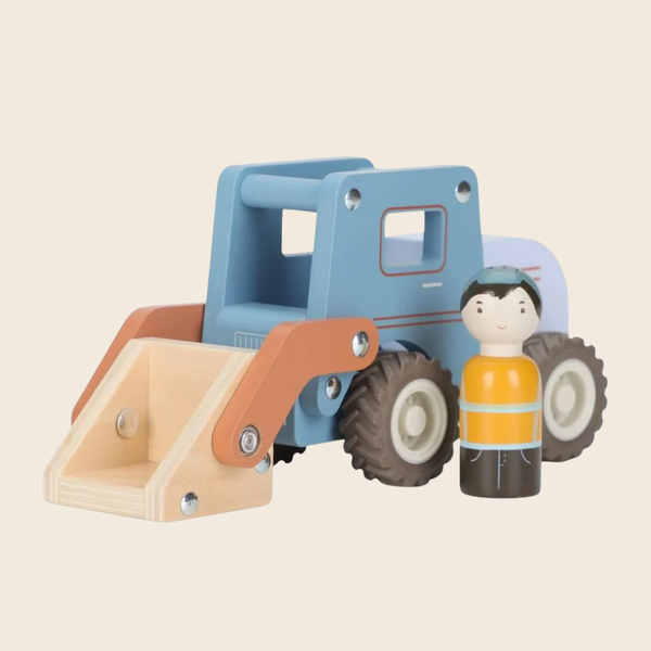 A wooden toy construction vehicle with a light blue cab, tan front loader, and brown wheels, shown next to a small wooden worker figure on a plain beige background.