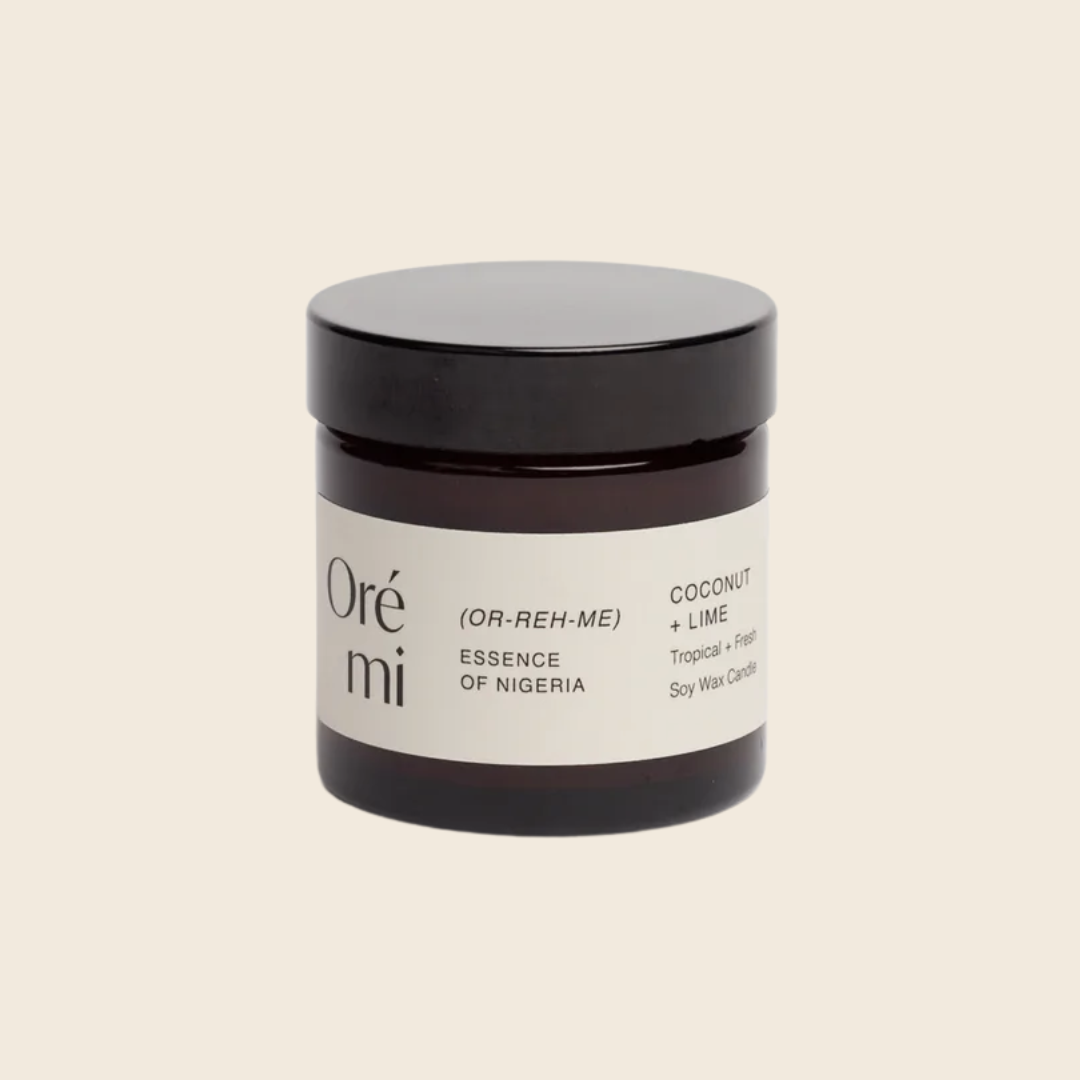 Jar of Ore Mi coconut lime candle on a beige background