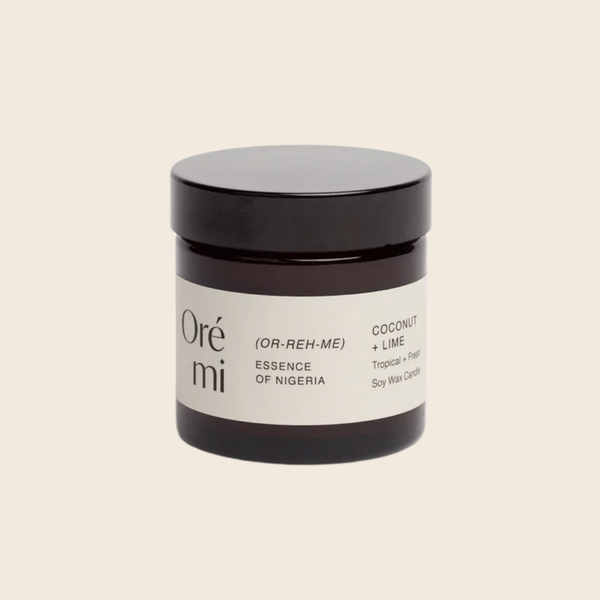 Jar of Ore Mi coconut lime candle on a beige background