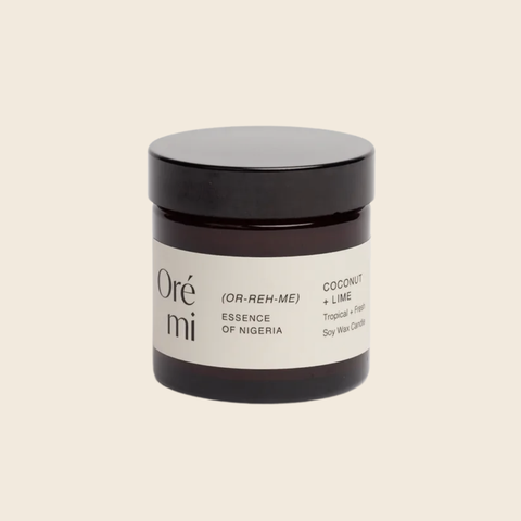 Jar of Ore Mi coconut lime candle on a beige background