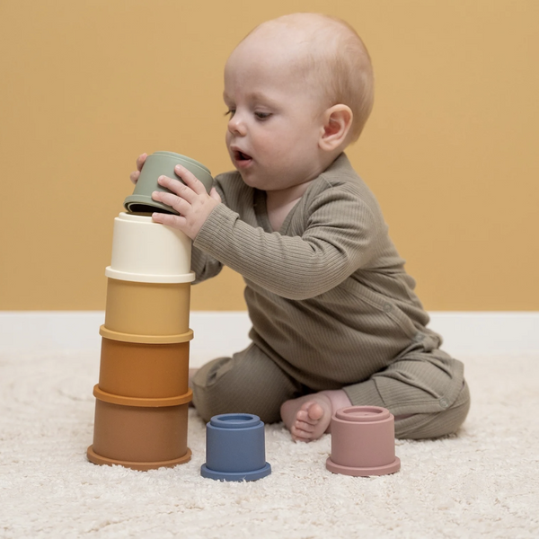 Baby playing with Little Dutch Rainbow Stacking Cups